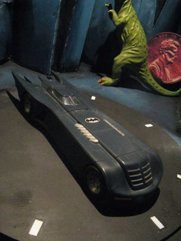 I can't tell you what this Batmobile did for me, but this was it...I got my figures, stuck in a glass case, and then bought this bad boy.  This is the peice that got me thinking with my little display... "wouldn't it be cool if somebody made a Batcave to put it in?"  Well, nobody did...at least not one that I could get my hands on.  So I made it.  This little peice of plastic cost me over 600 dollars in the end... even though I bought it for 20.  Go figure.
